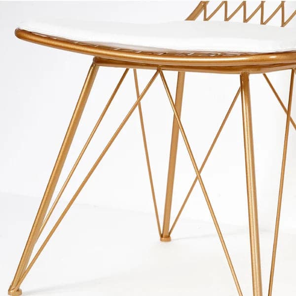 Chaise de salle à manger Glam en métal creuse avec coussin en cuir PU au fini doré