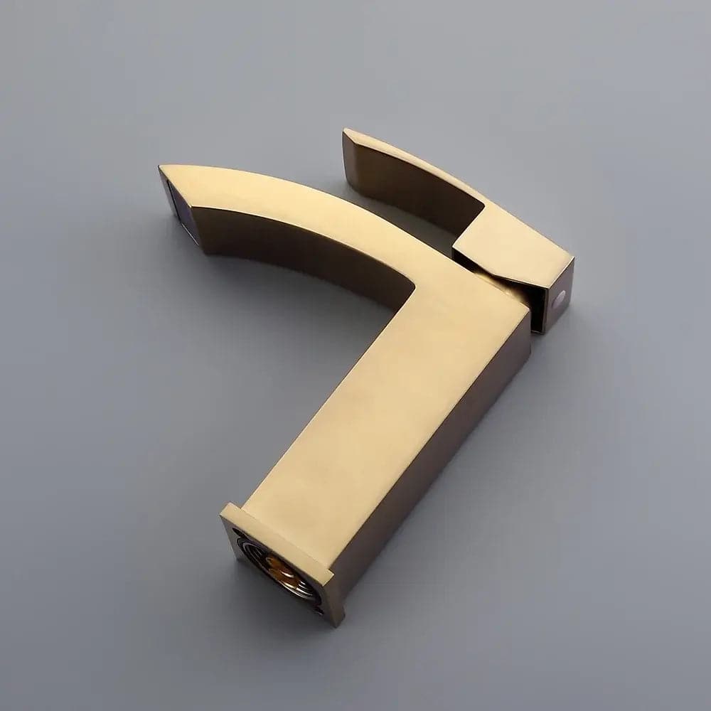 Robinet de lavabo de salle de bain monotrou monté sur pont en or brossé de style contemporain